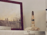 a painting on a shelf