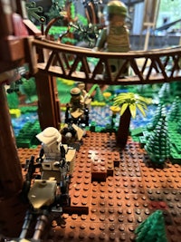 a lego scene with soldiers and a bridge