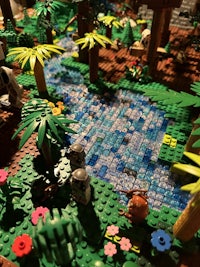 a lego jungle with lots of plants and trees