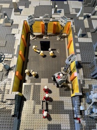 a lego model of a building with people in it