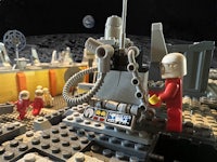 a lego model of a spacecraft on the moon