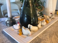 a tray of chicken figurines on a table